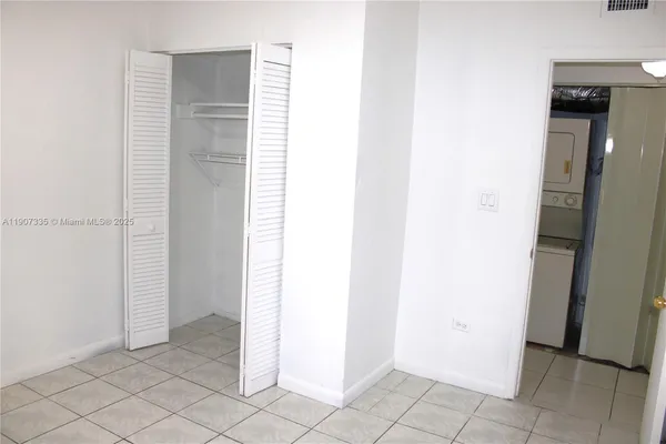 a white toilet sitting next to a sink