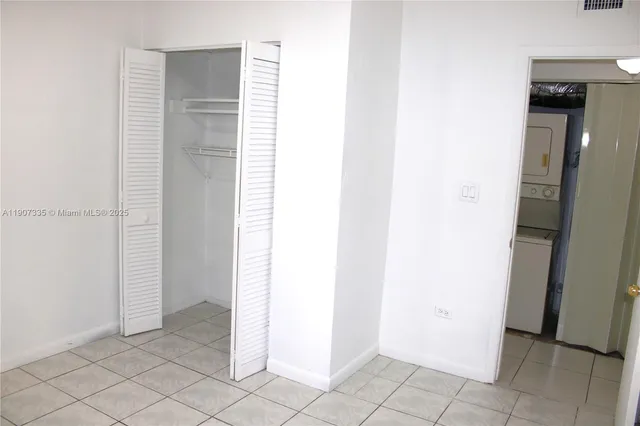 a white toilet sitting next to a sink