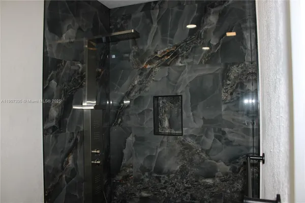 a bathroom with a sink and mirror