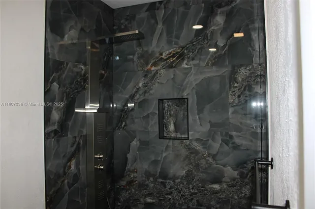 a bathroom with a sink and mirror