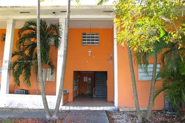 a view of a house with a tree