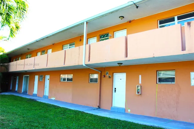 a front view of building with yard