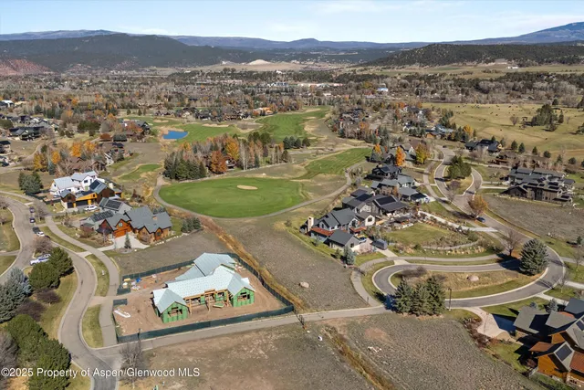 an aerial view of residential house with outdoor space