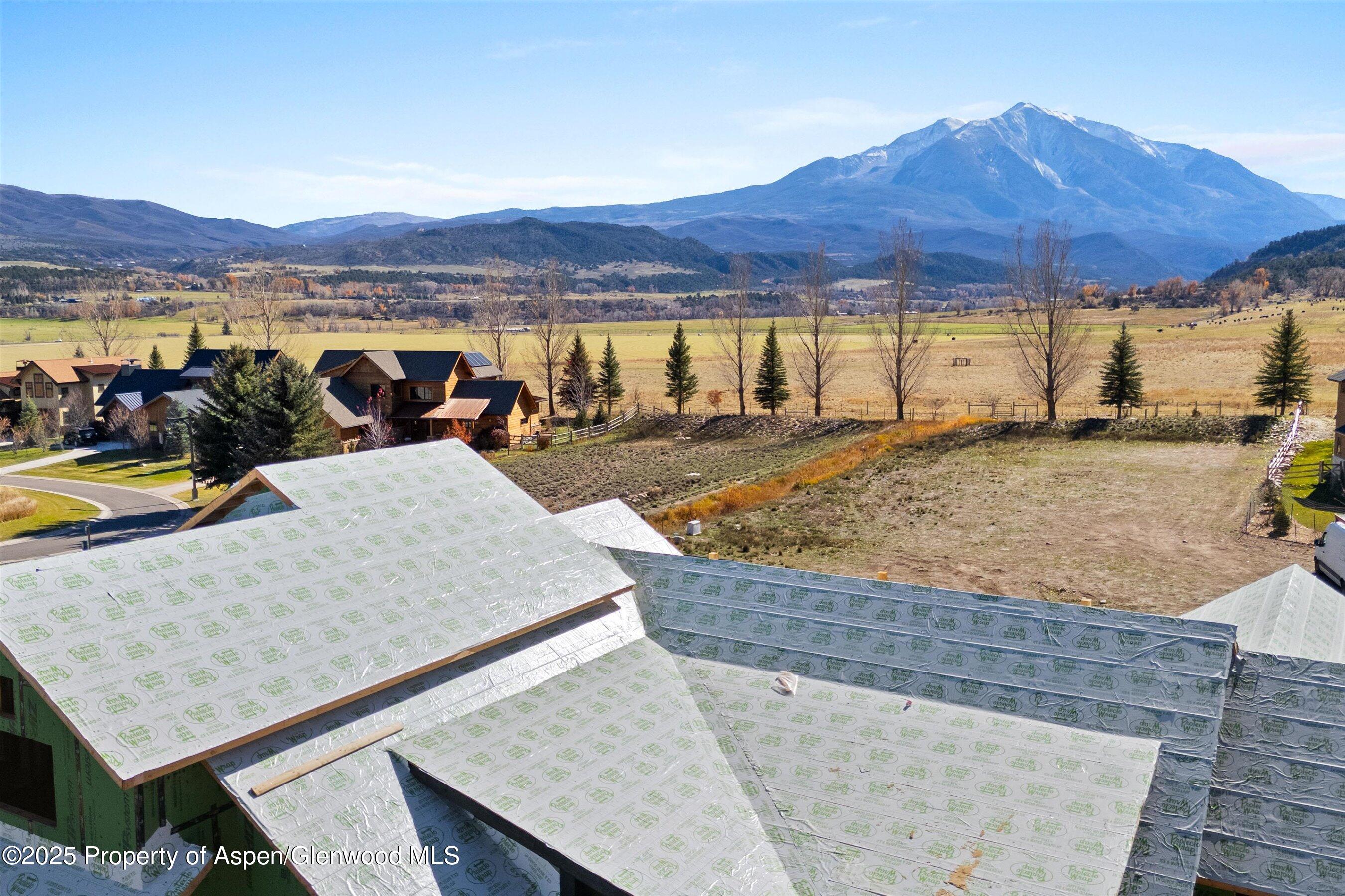 860 Perry Ridge Carbondale, CO 81623 - Photo 17 of 17 a view of a swimming pool with a table and chairs