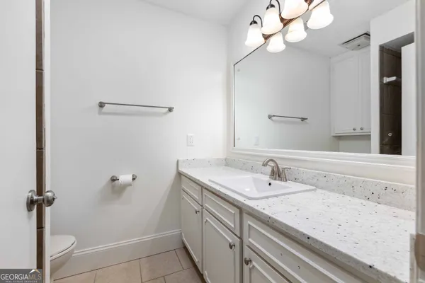 a bathroom with a sink a vanity and a mirror