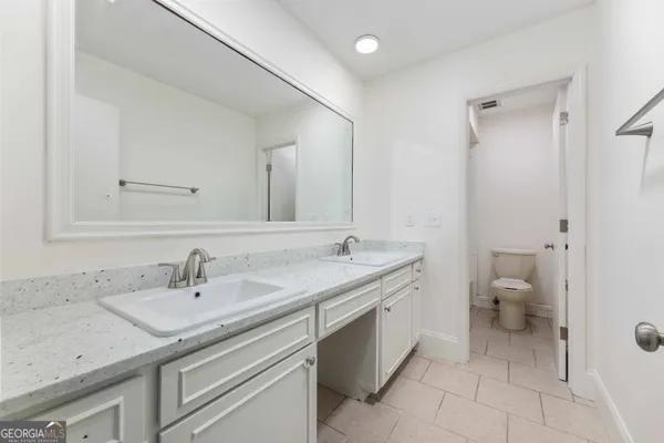 a bathroom with a sink and a toilet