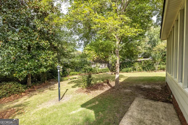 a backyard of a house with lots of green space