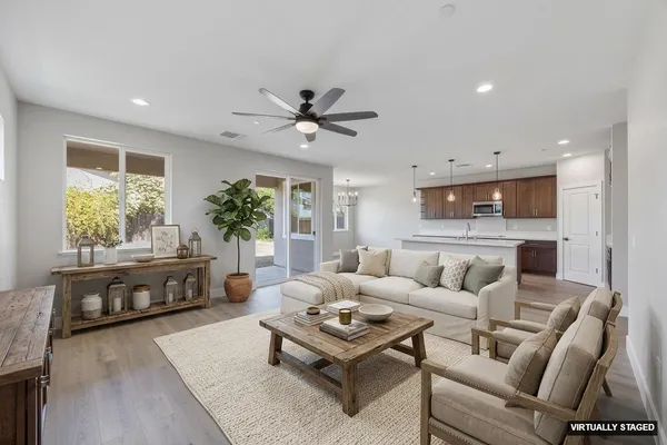 a bathroom with a shower sink vanity mirror and toilet