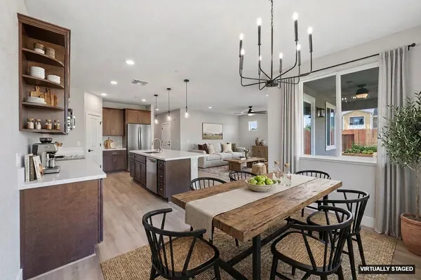 a living room with furniture chandelier and a chandelier