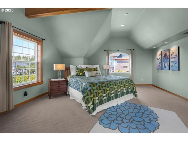 a bedroom with a large bed and a window