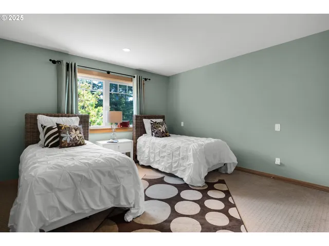 a bedroom with a bed and a night stand