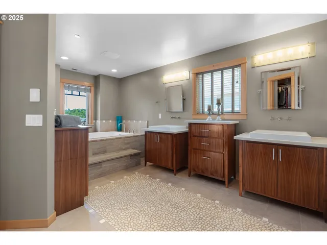 a kitchen with sink and cabinets