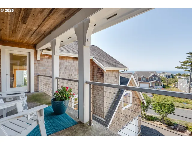 a view of a living room and a balcony