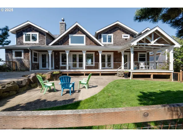 a front view of a house with a yard table and chairs