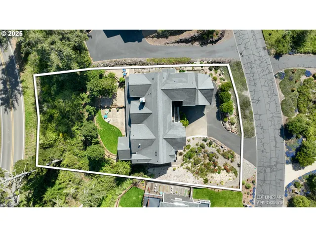 an aerial view of a house with a yard