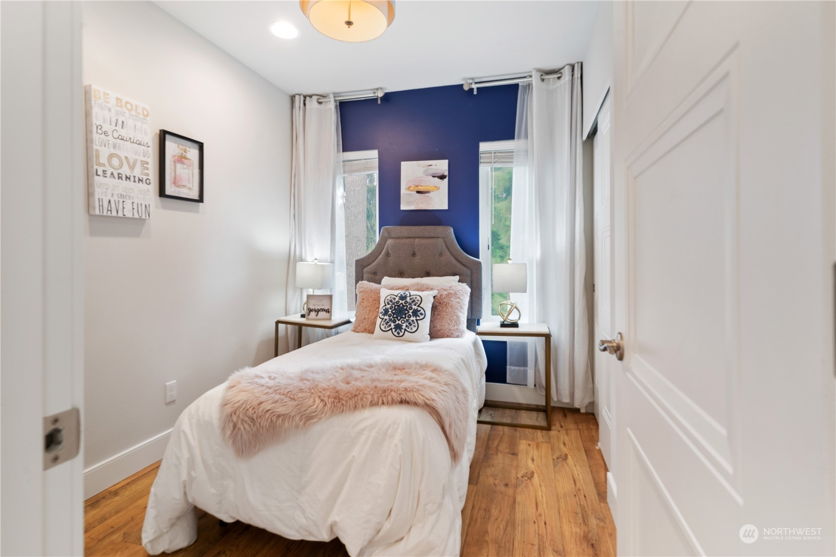 18613 103rd Avenue Northeast Bothell, WA 98011 - Photo 22 of 35 a bedroom with a bed and wooden floor