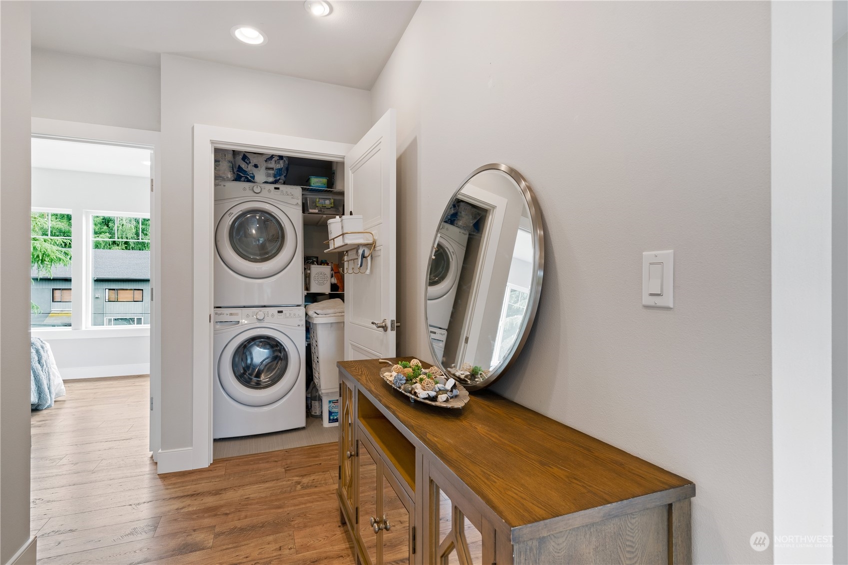 18613 103rd Avenue Northeast Bothell, WA 98011 - Photo 24 of 35 a view of a storage and utility room with washer and dryer
