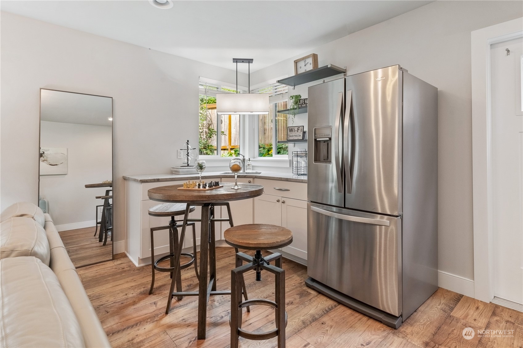 18613 103rd Avenue Northeast Bothell, WA 98011 - Photo 28 of 35 a kitchen with stainless steel appliances a refrigerator a table and chairs in it