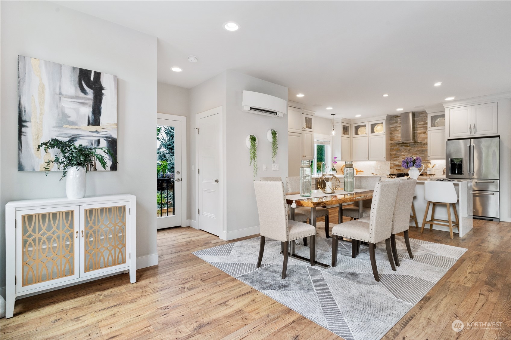18613 103rd Avenue Northeast Bothell, WA 98011 - Photo 5 of 35 a dining room with wooden floor and a rug
