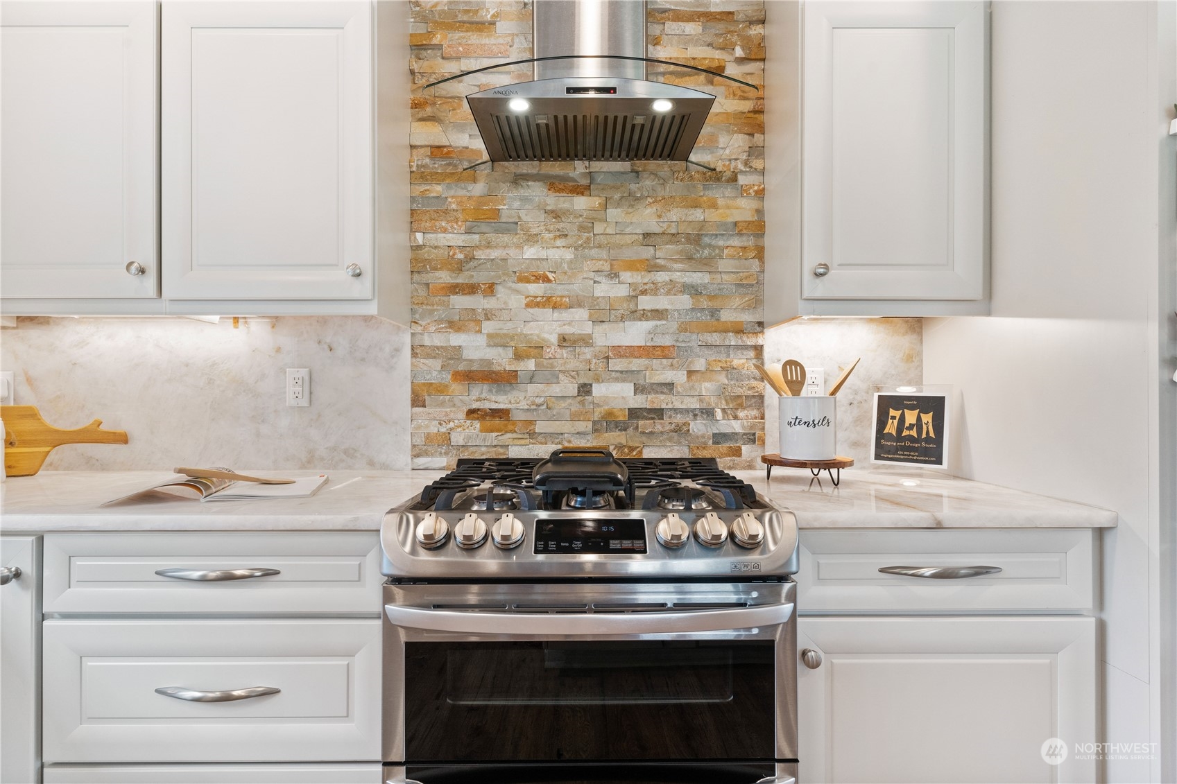 18613 103rd Avenue Northeast Bothell, WA 98011 - Photo 10 of 35 a stove top oven sitting inside of a kitchen