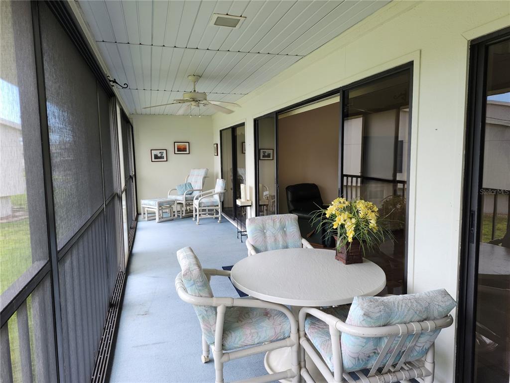 4260 Placida Road, Unit 21D Englewood, FL 34224 - Photo 12 of 38 a view of a dining room with furniture and a potted plant
