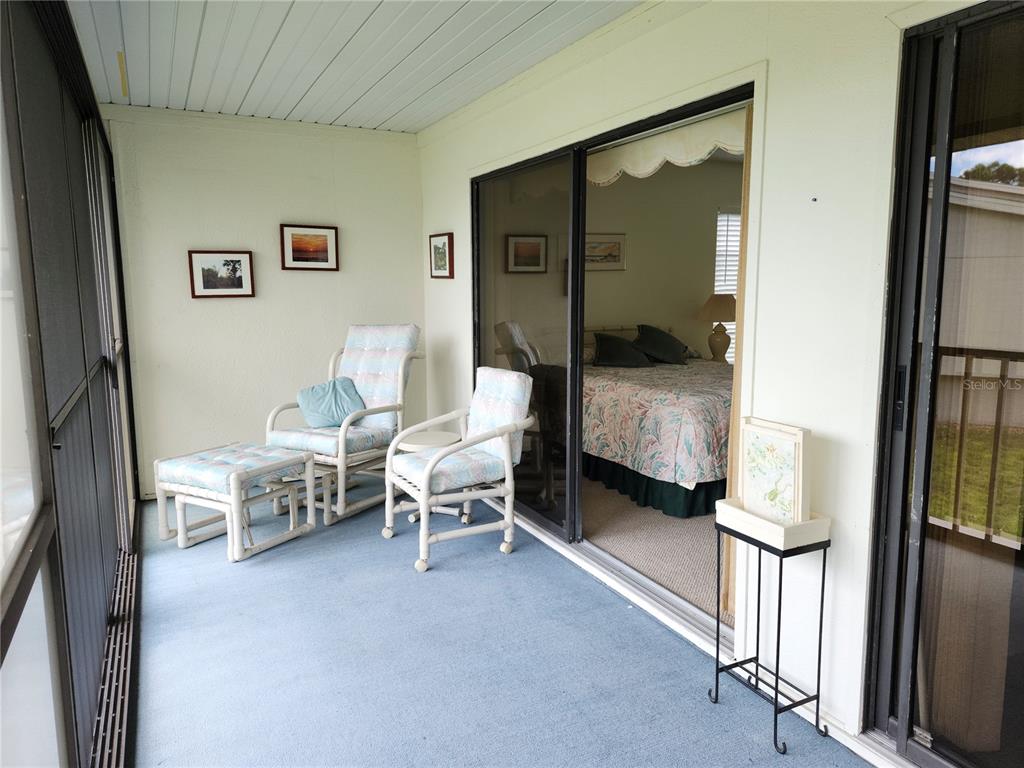 4260 Placida Road, Unit 21D Englewood, FL 34224 - Photo 13 of 38 a bedroom with bed and a window