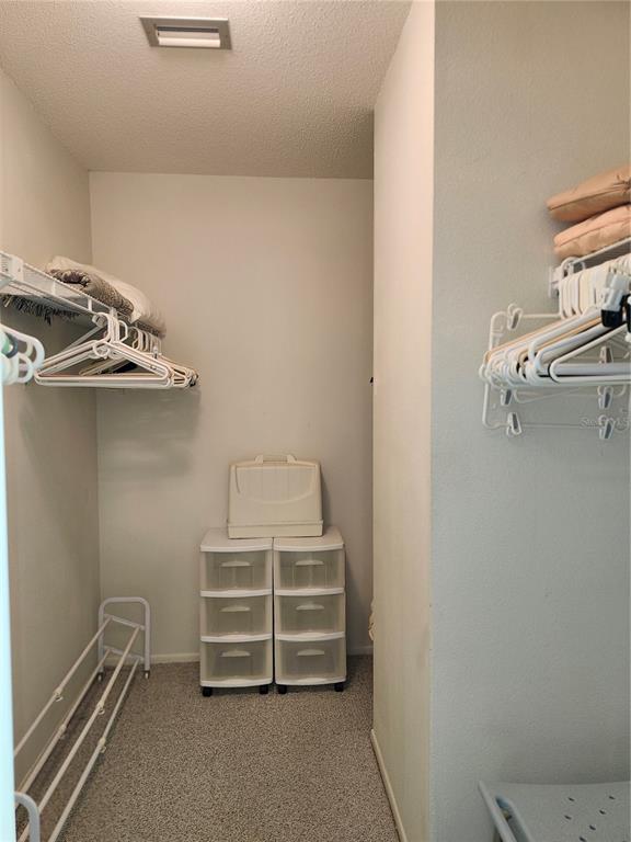 4260 Placida Road, Unit 21D Englewood, FL 34224 - Photo 20 of 38 a view of walk in closet with empty racks