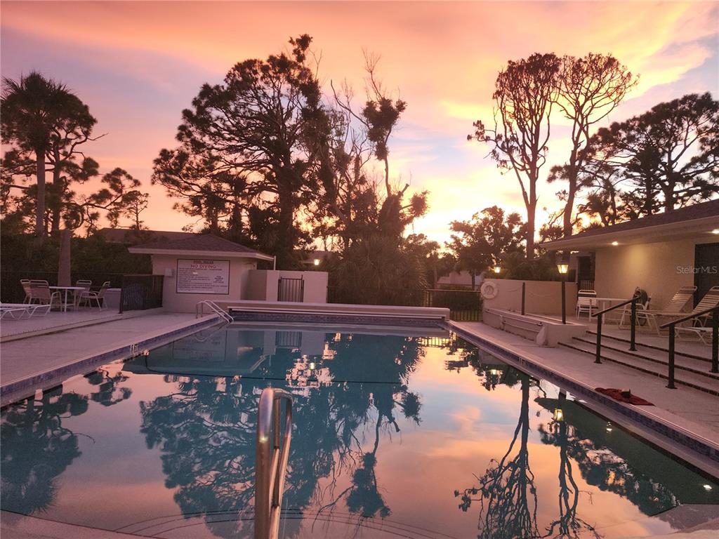 4260 Placida Road, Unit 21D Englewood, FL 34224 - Photo 2 of 38 a view of a swimming pool with a patio