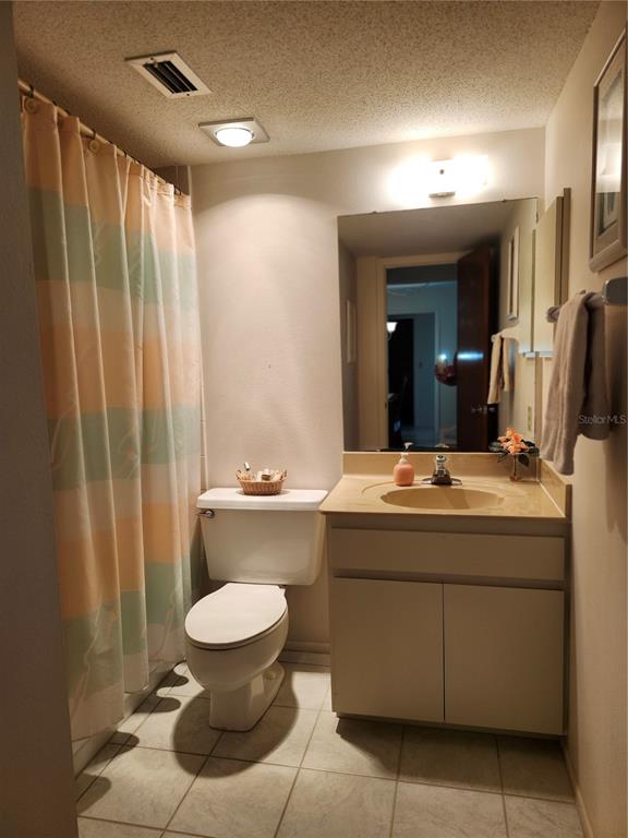 4260 Placida Road, Unit 21D Englewood, FL 34224 - Photo 26 of 38 a bathroom with a toilet sink and mirror