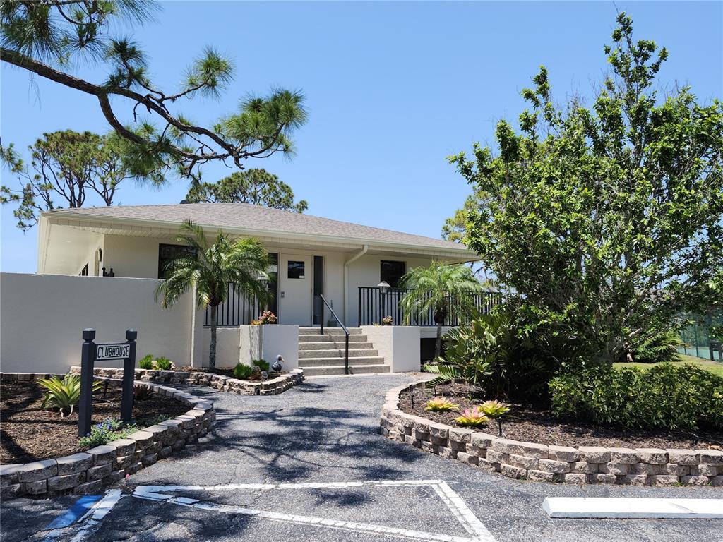 4260 Placida Road, Unit 21D Englewood, FL 34224 - Photo 32 of 38 a front view of a house with entryway