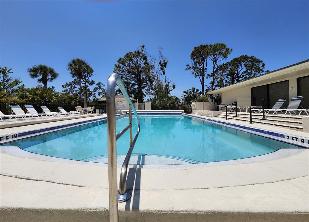 4260 Placida Road, Unit 21D Englewood, FL 34224 - Photo 33 of 38 a view of a swimming pool with a seating space