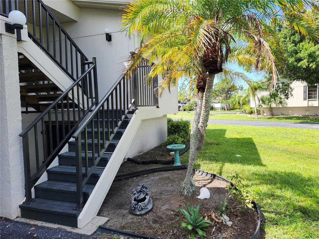 4260 Placida Road, Unit 21D Englewood, FL 34224 - Photo 4 of 38 a view of a garden with swimming pool