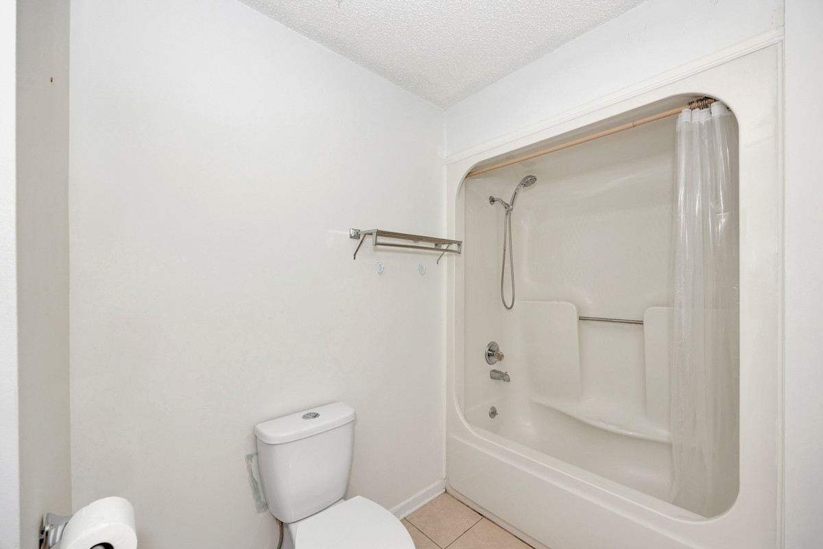 81 Slaughter Pen Road Ardmore, TN 38449 - Photo 18 of 63 a bathroom with a toilet and a shower