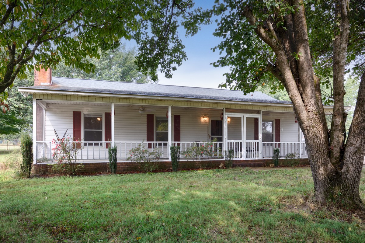 81 Slaughter Pen Road Ardmore, TN 38449 - Photo 21 of 63 front view of a house with a yard