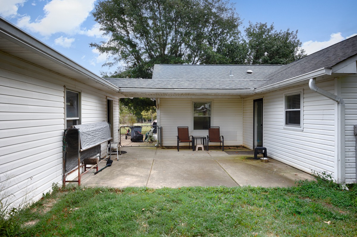 81 Slaughter Pen Road Ardmore, TN 38449 - Photo 23 of 63 a view of a backyard with a sitting area and furniture