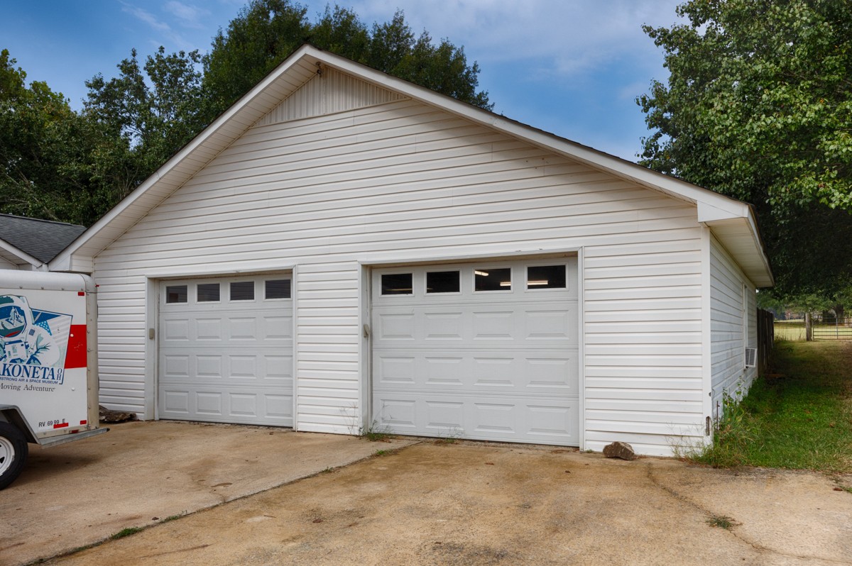 81 Slaughter Pen Road Ardmore, TN 38449 - Photo 25 of 63 a view of a house with garage