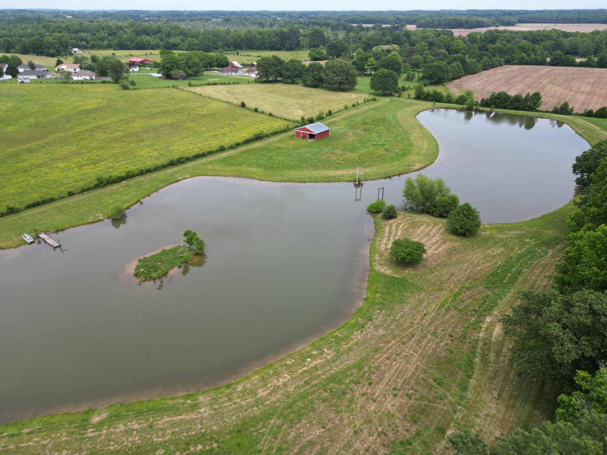 81 Slaughter Pen Road Ardmore, TN 38449 - Photo 57 of 63 an aerial view of a house with a garden and lake view