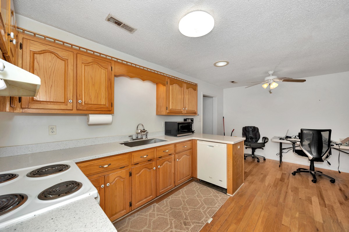 81 Slaughter Pen Road Ardmore, TN 38449 - Photo 7 of 63 a kitchen with a sink and cabinets