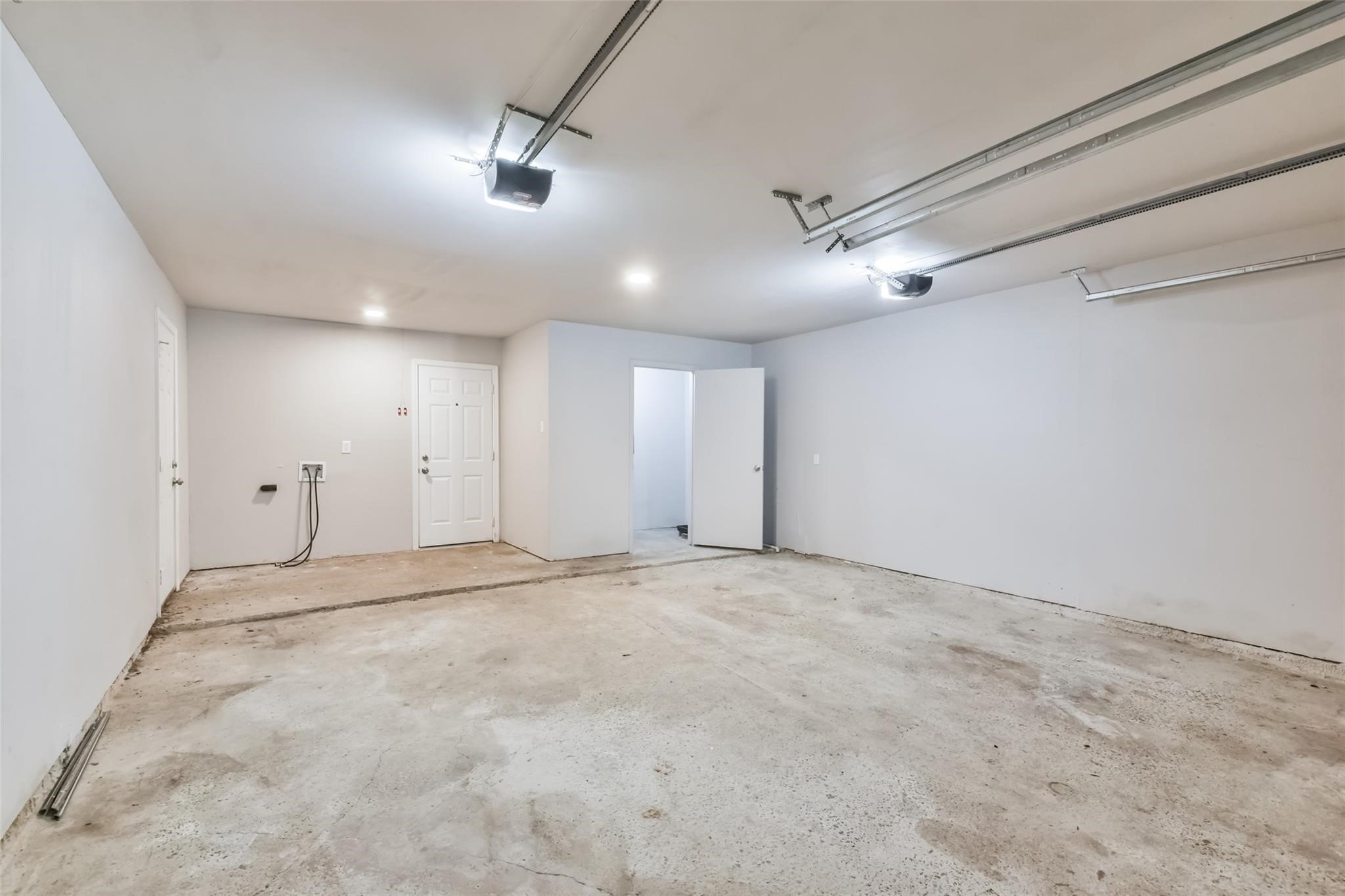 23102 Wintergate Drive Spring, TX 77373 - Photo 19 of 19 2 car garage with double garage door openers and bonus storage area!