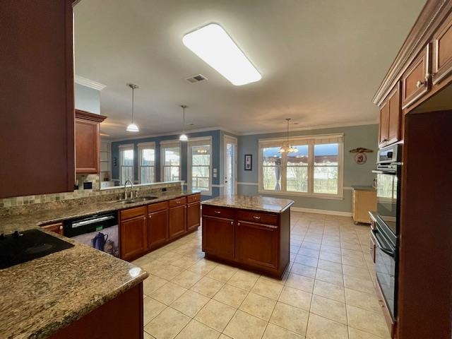 8028 Old Brownsville Road Bartlett, TN 38002 - Photo 11 of 35 a large kitchen with stainless steel appliances granite countertop a sink and a stove