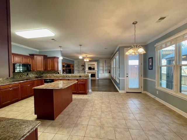 8028 Old Brownsville Road Bartlett, TN 38002 - Photo 35 of 35 a large kitchen with kitchen island a island a stove a counter top space a sink and cabinets