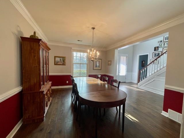 8028 Old Brownsville Road Bartlett, TN 38002 - Photo 13 of 35 a dining room with furniture a chandelier and wooden floor
