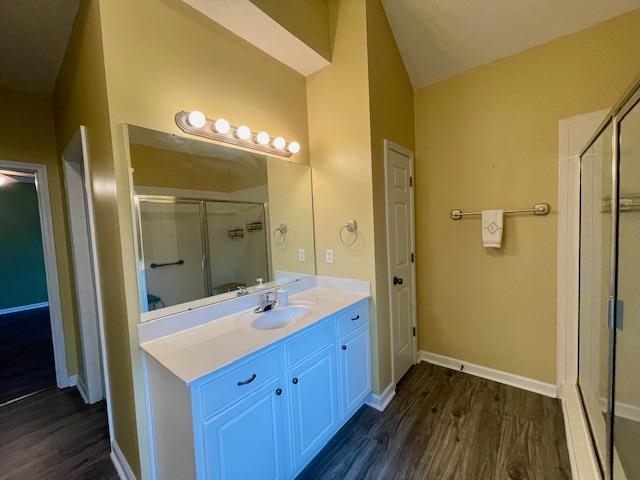 8028 Old Brownsville Road Bartlett, TN 38002 - Photo 19 of 35 a bathroom with a double vanity sink and mirror with shower