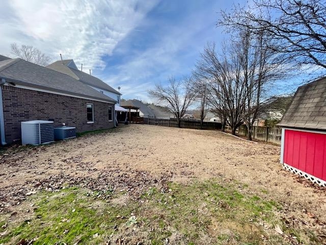 8028 Old Brownsville Road Bartlett, TN 38002 - Photo 33 of 35 a view of a backyard with a large tree
