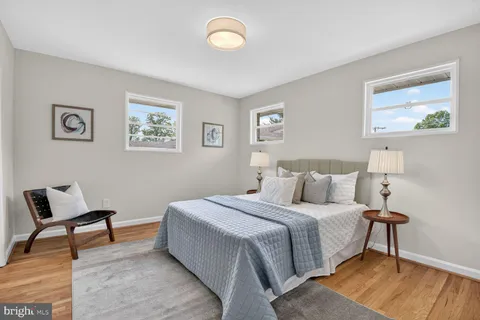 a bedroom with a bed and a chair