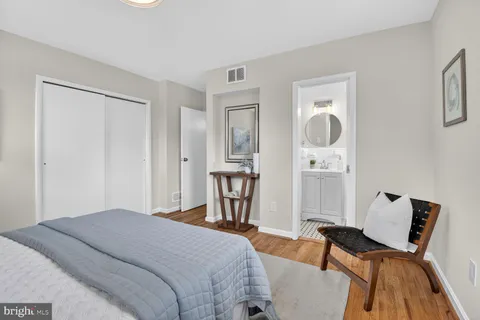 a bedroom with a bed and furniture