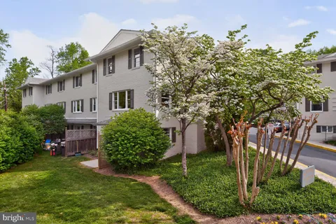 front view of a house with a garden