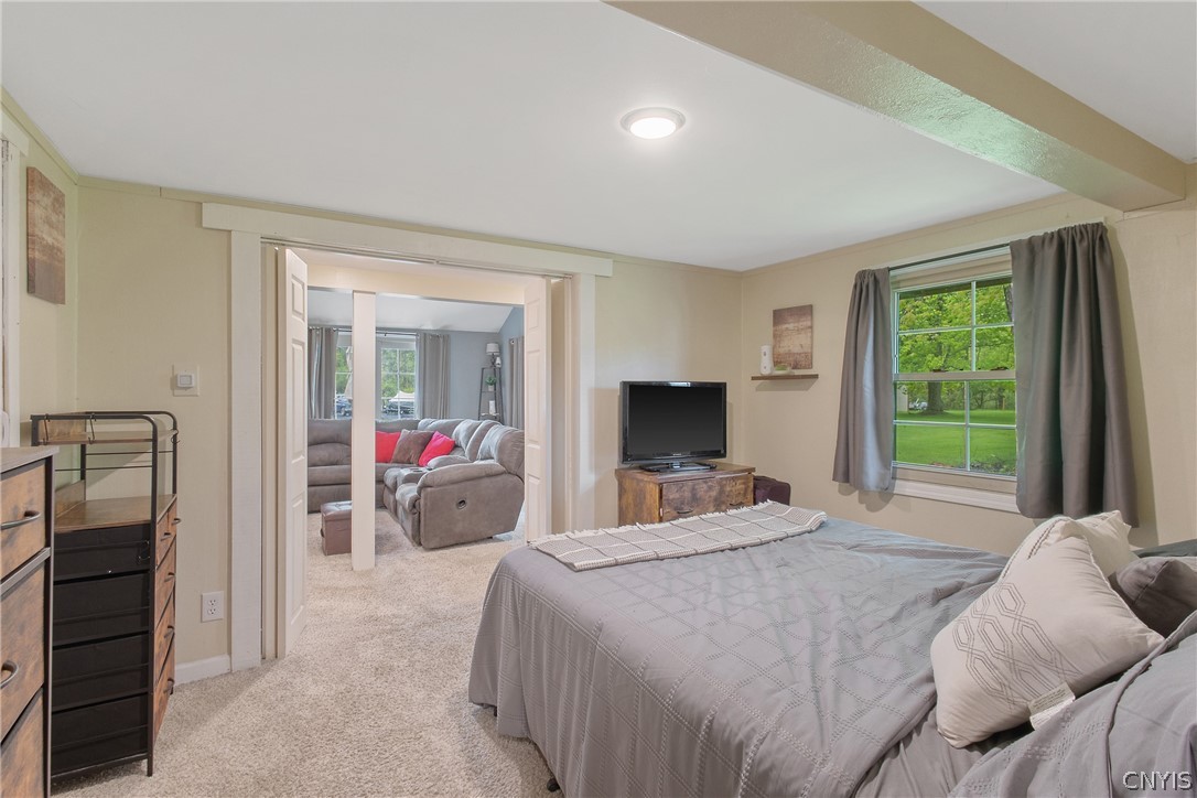 8355 Tuttle Road Cicero, NY 13030 - Photo 22 of 46 The primary suite is off the living room ...