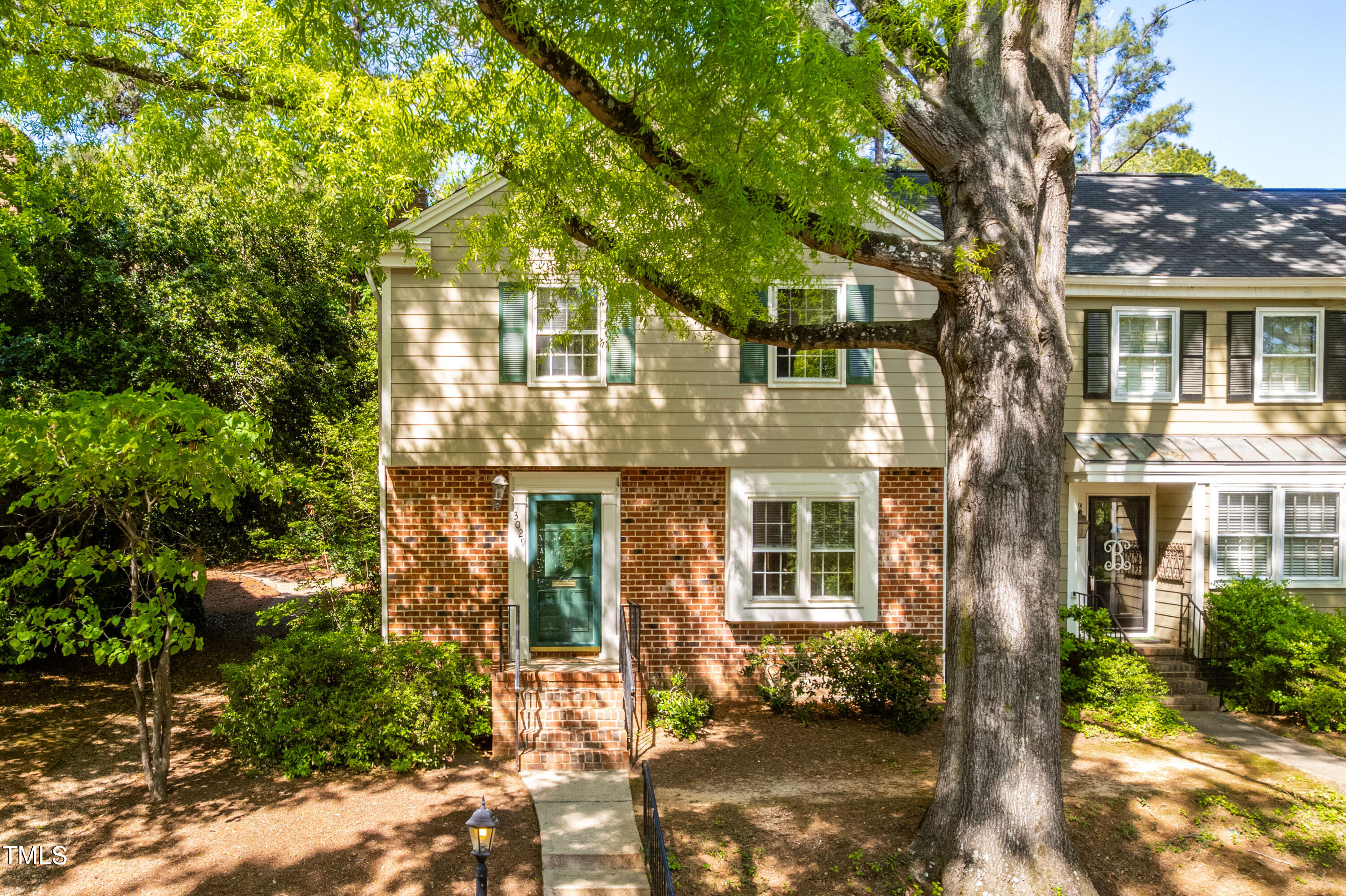 3029 Wycliff Road Raleigh, NC 27607 - Photo 1 of 35 front view of a house with a tree
