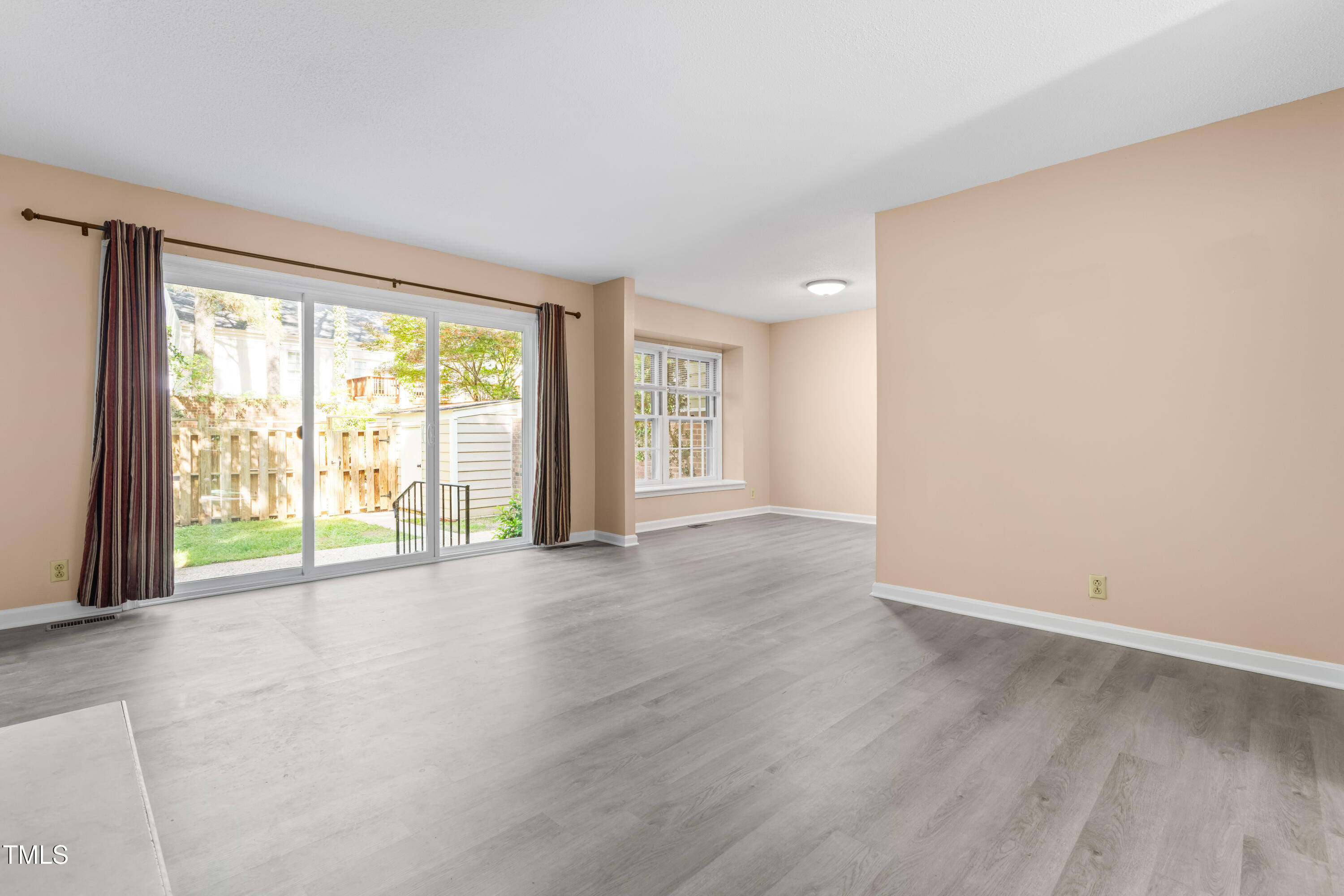 3029 Wycliff Road Raleigh, NC 27607 - Photo 11 of 35 an empty room with wooden floor and windows